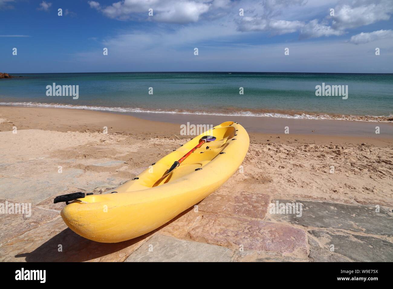 Portugal Atlantic coast landscape in Algarve region. Burgau sandy beach. Sea kayaking. Stock Photo