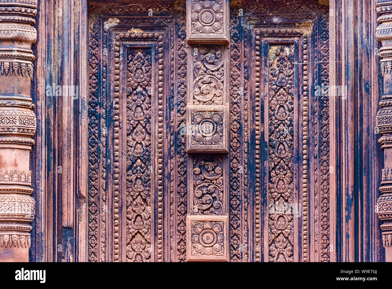 Blind door, balusters carved into the red sandstone walls in Banteay ...