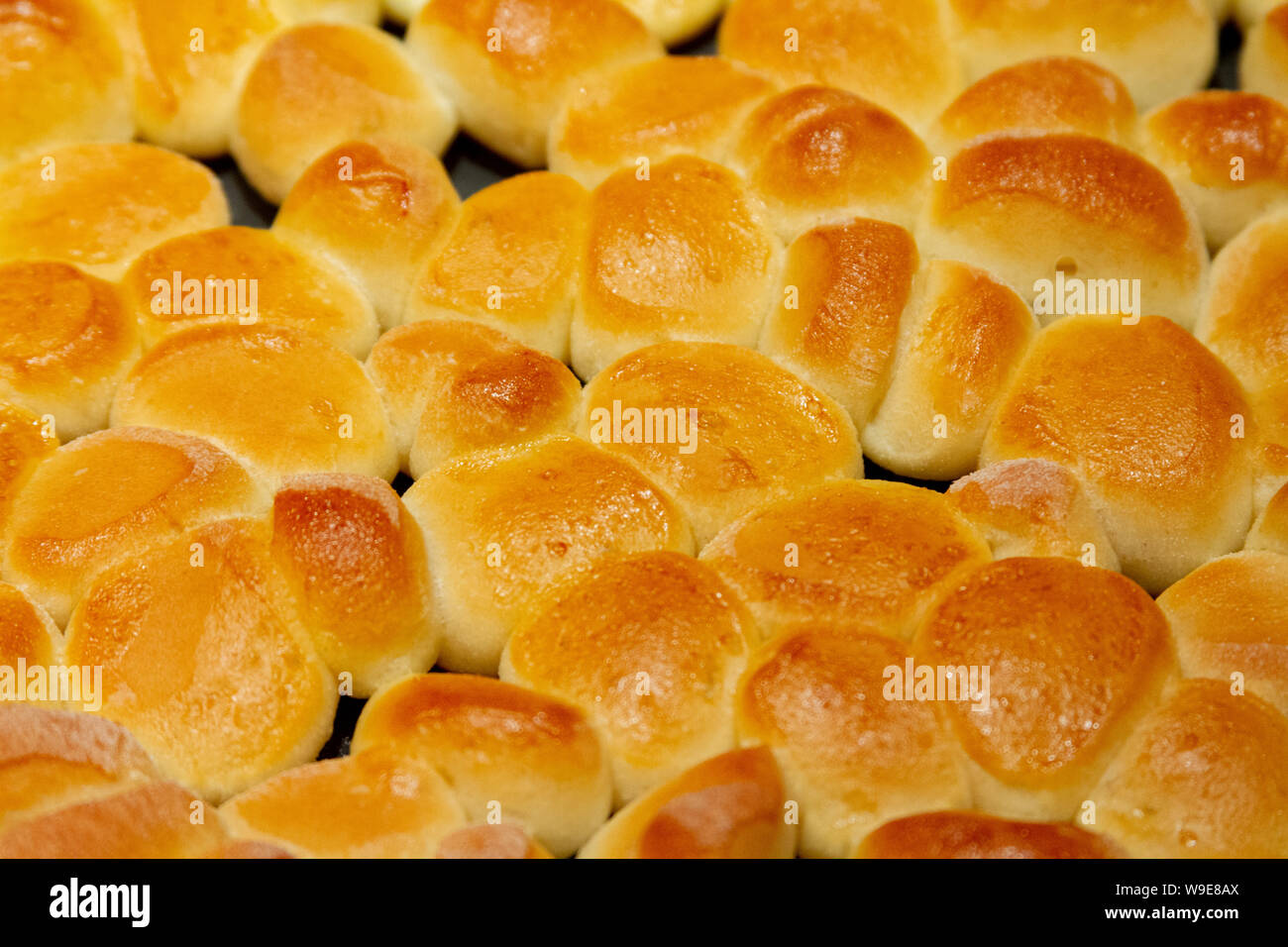 preparation and baking of 'Bobalky' - traditional Slovak baked bread pieces (dumplings or gnocchi) eaten usually with poppy or curd cheese or cabbage Stock Photo