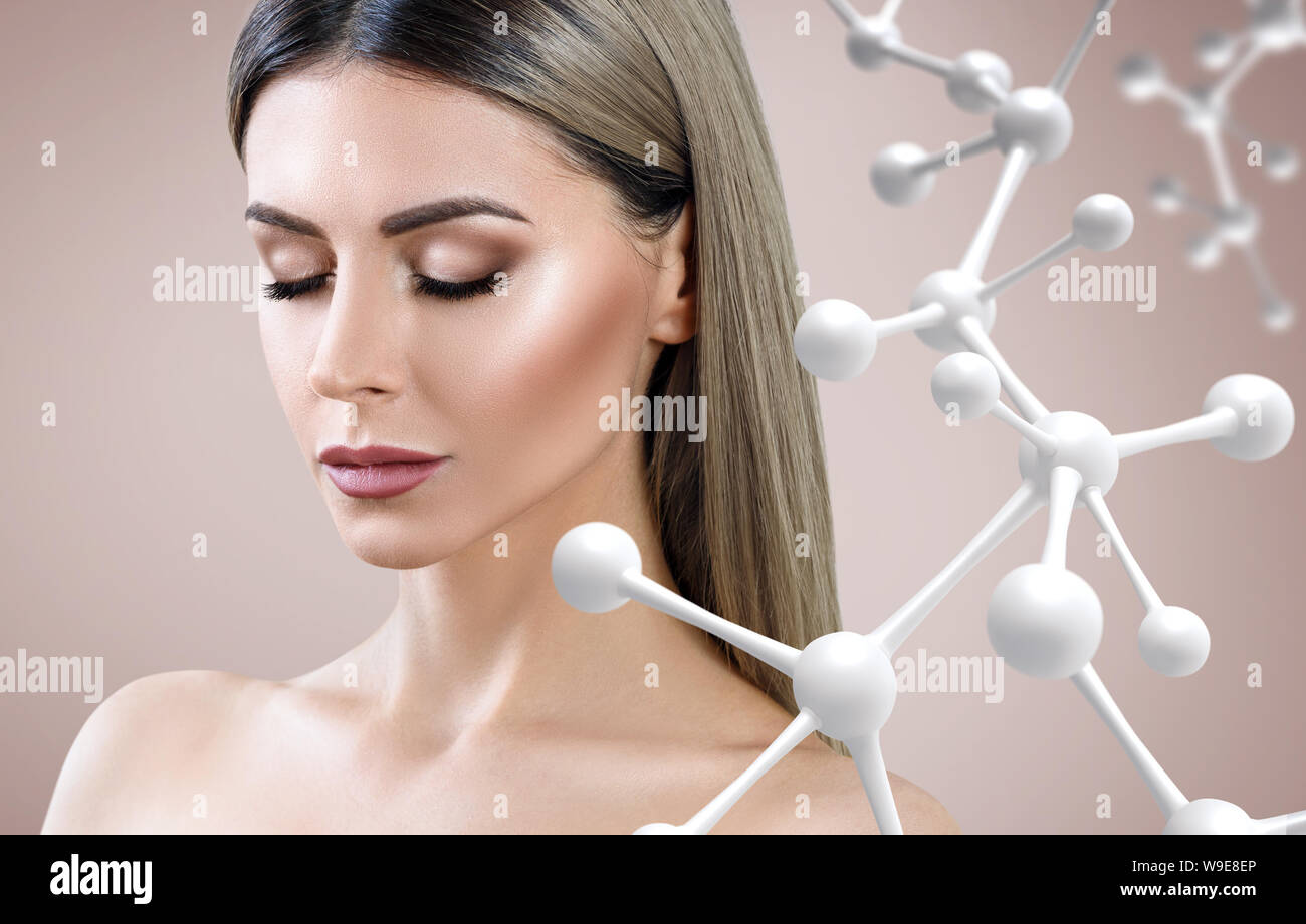 Beautiful woman near big white molecule chain. Stock Photo