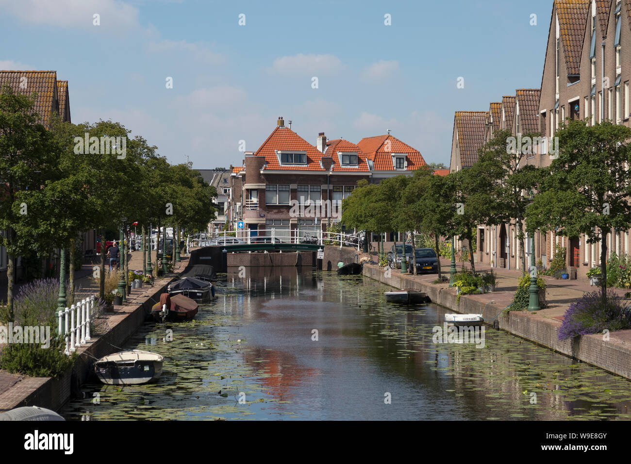 Leiden, Holland - July 05, 2019: View of the Oranje Gracht towards the Zuidsingel, canal with trees, plants and boats in summer Stock Photo