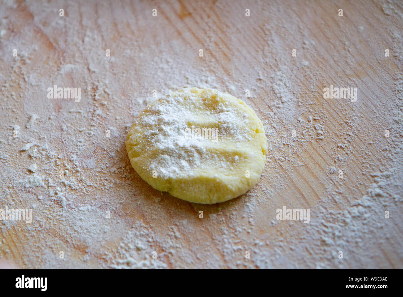 preparation of a dough for baking on a chopping board Stock Photo