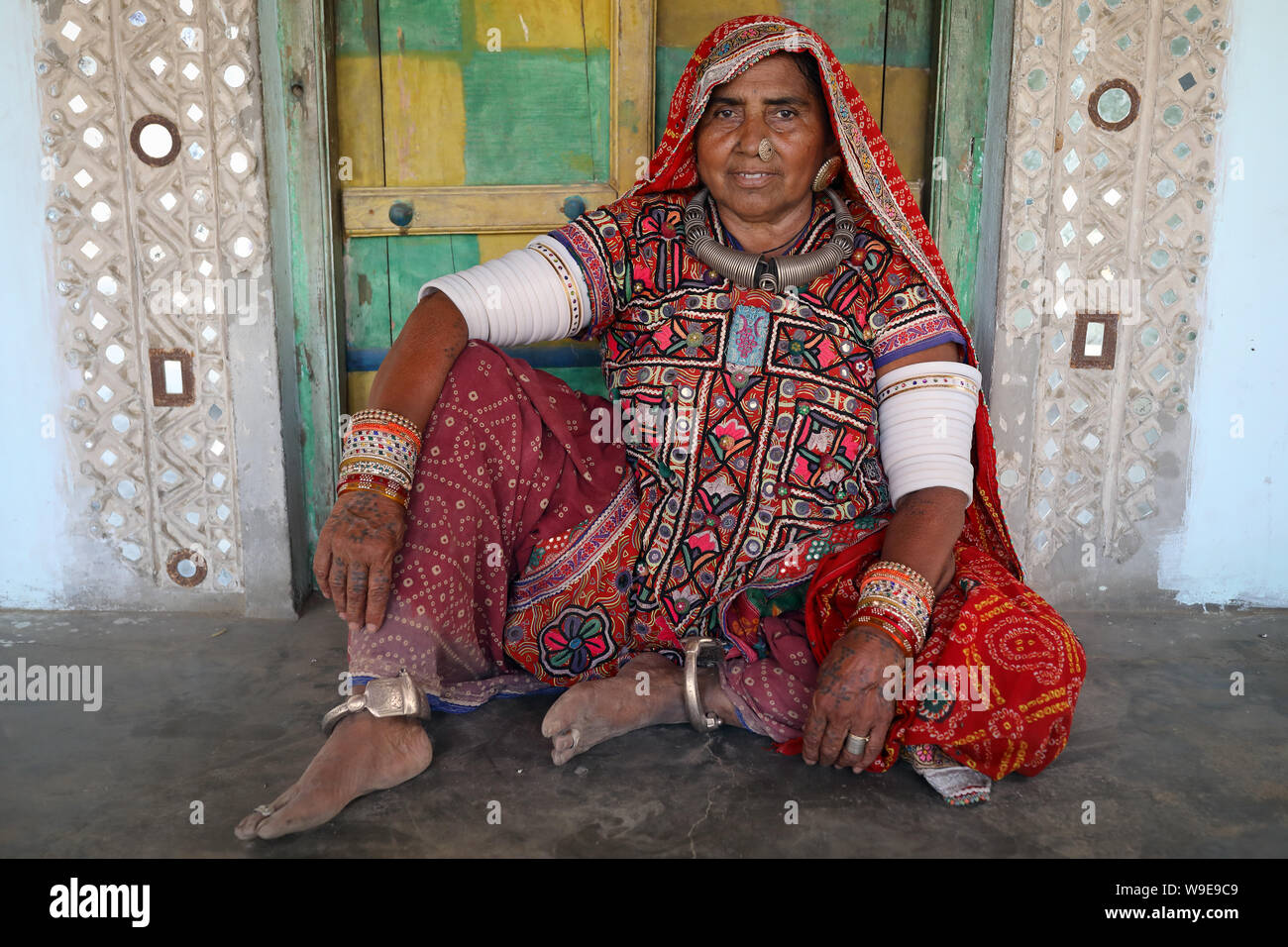 Tribal woman in a rural village in the district of Kutch, Gujarat. The Kutch region is well known for its tribal life and traditional culture. Stock Photo