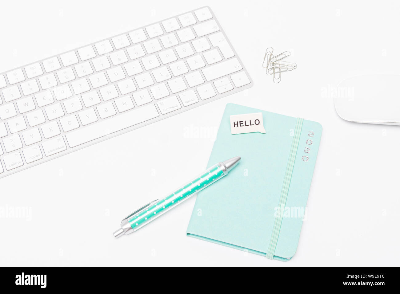 Desk with keyboard and mouse, calendar 2020 and a pen. Stock Photo