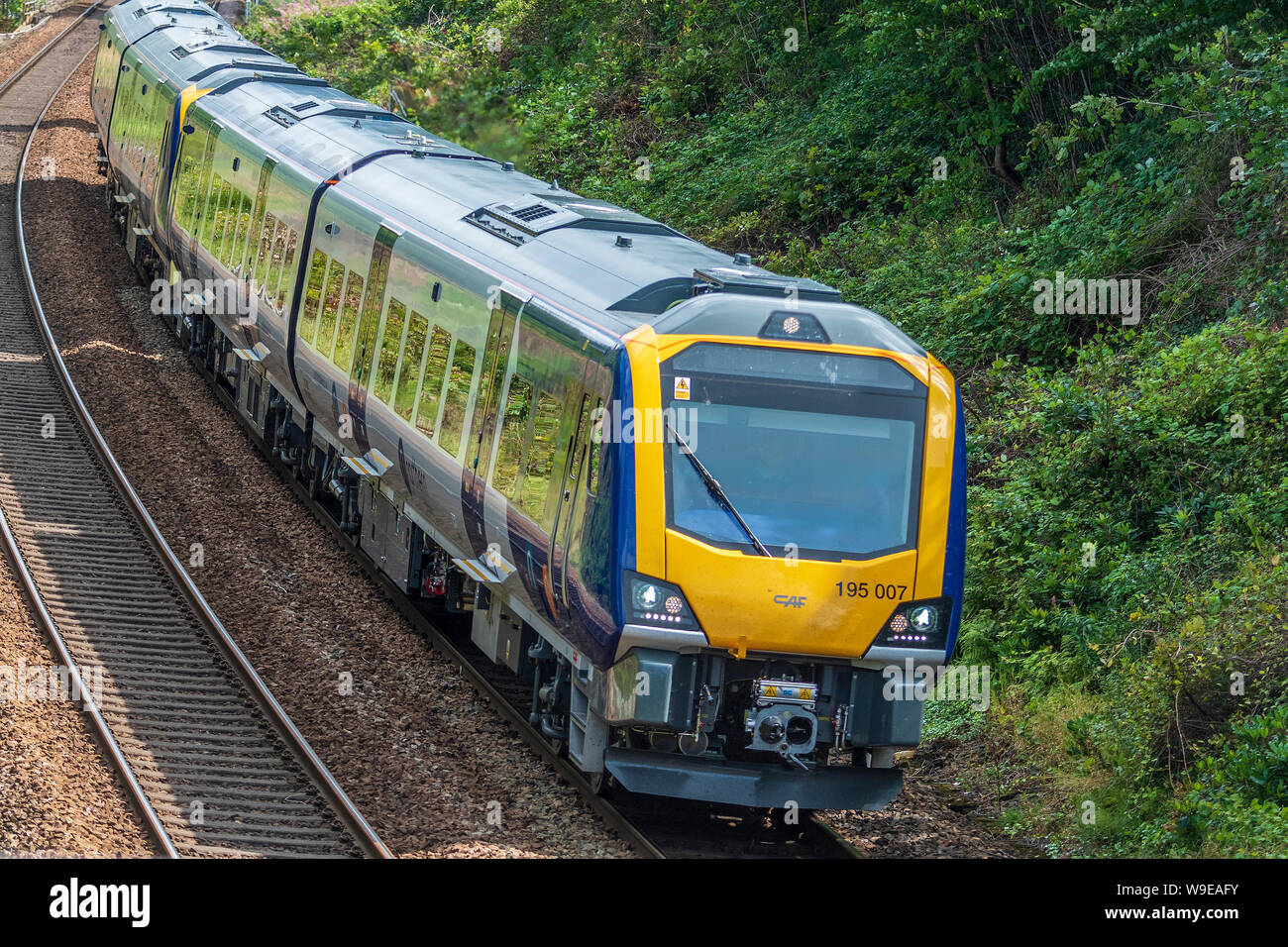 New Class 195 diesel DMU train running on the Manchester to Liverpool