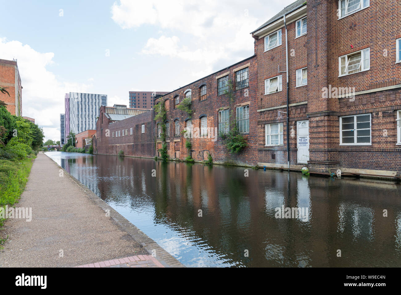 Old red brick buildings lining the Fazeley canal in Aston, Birmingham, UK Stock Photo