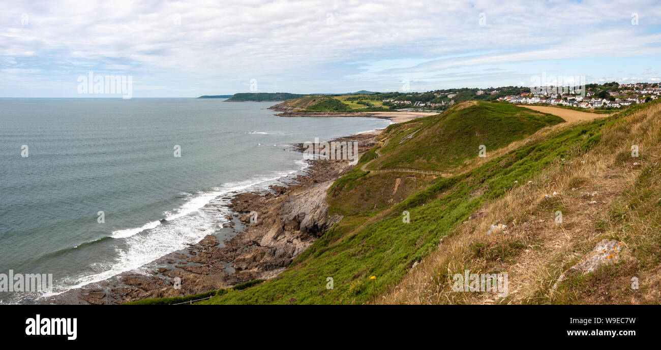 A panoramic view towards Langland Bay from the coastal path between Rotherslade and Limeslade Bay on Gower, Wales, UK Stock Photo