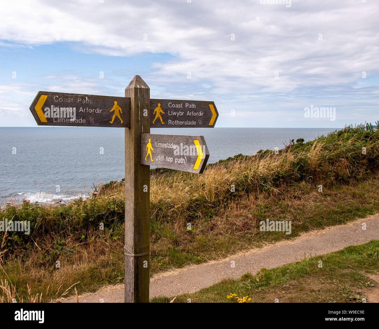 Coastal footpath signpost on the coastal path between Rotherslade and Limeslade Bay on Gower, Wales, UK Stock Photo