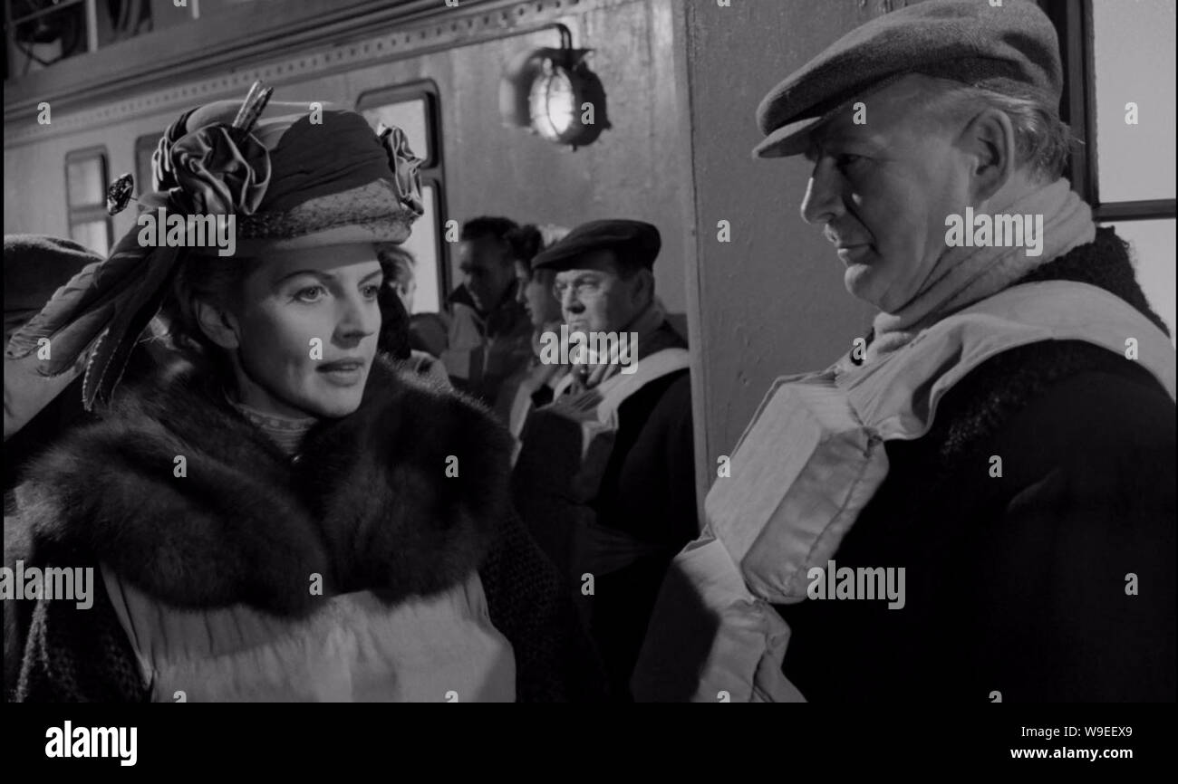 London. UK. Harriette Johns and Patrick Waddington in a scene in ©Rank  Organisation film, A Night To Remember (1958) Director: Roy Ward Baker  Screenplay: Eric Ambler Source: William Lord's account of the