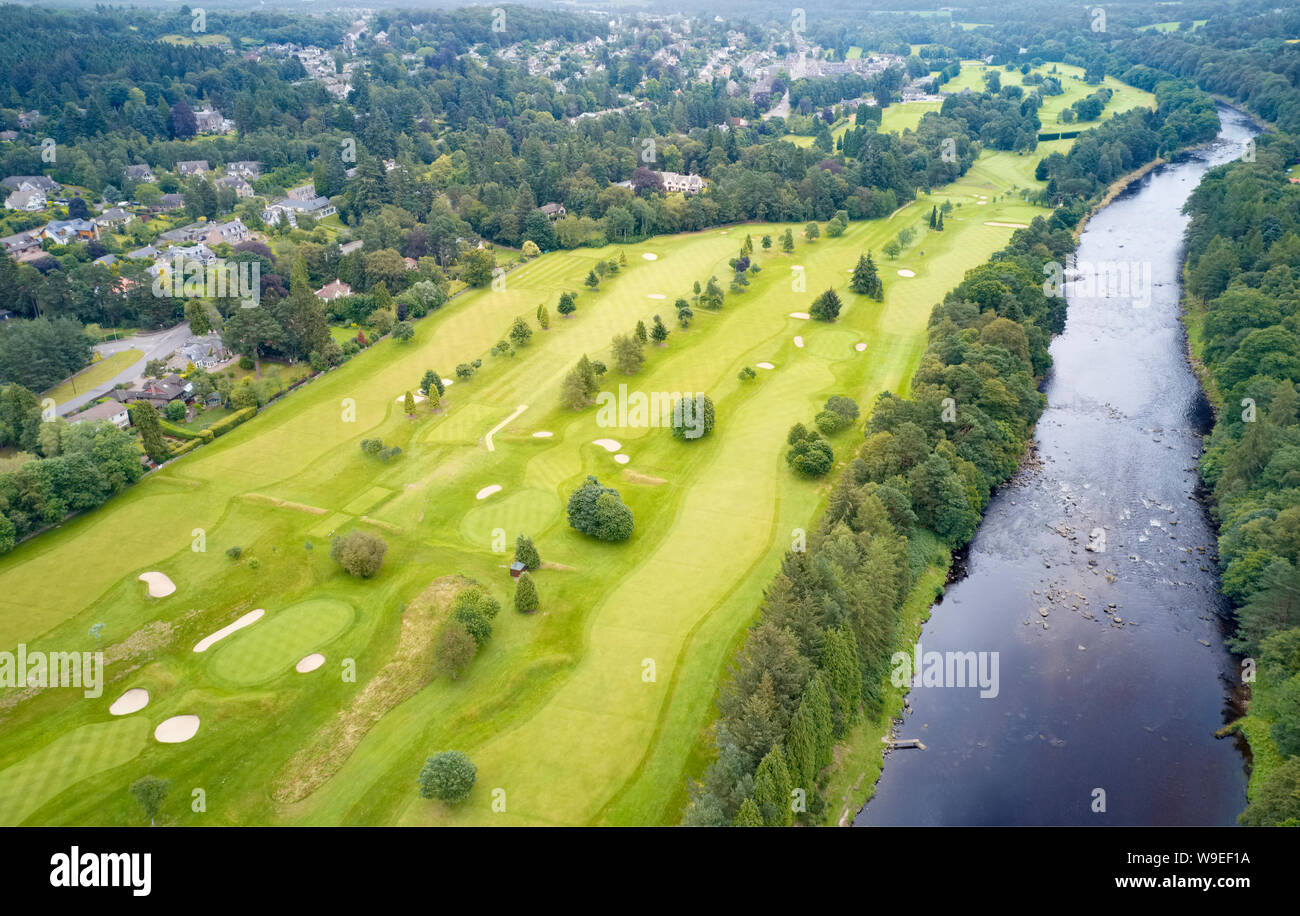 Aerial view of links golf course during summer showing green and bunkers at driving range Stock Photo