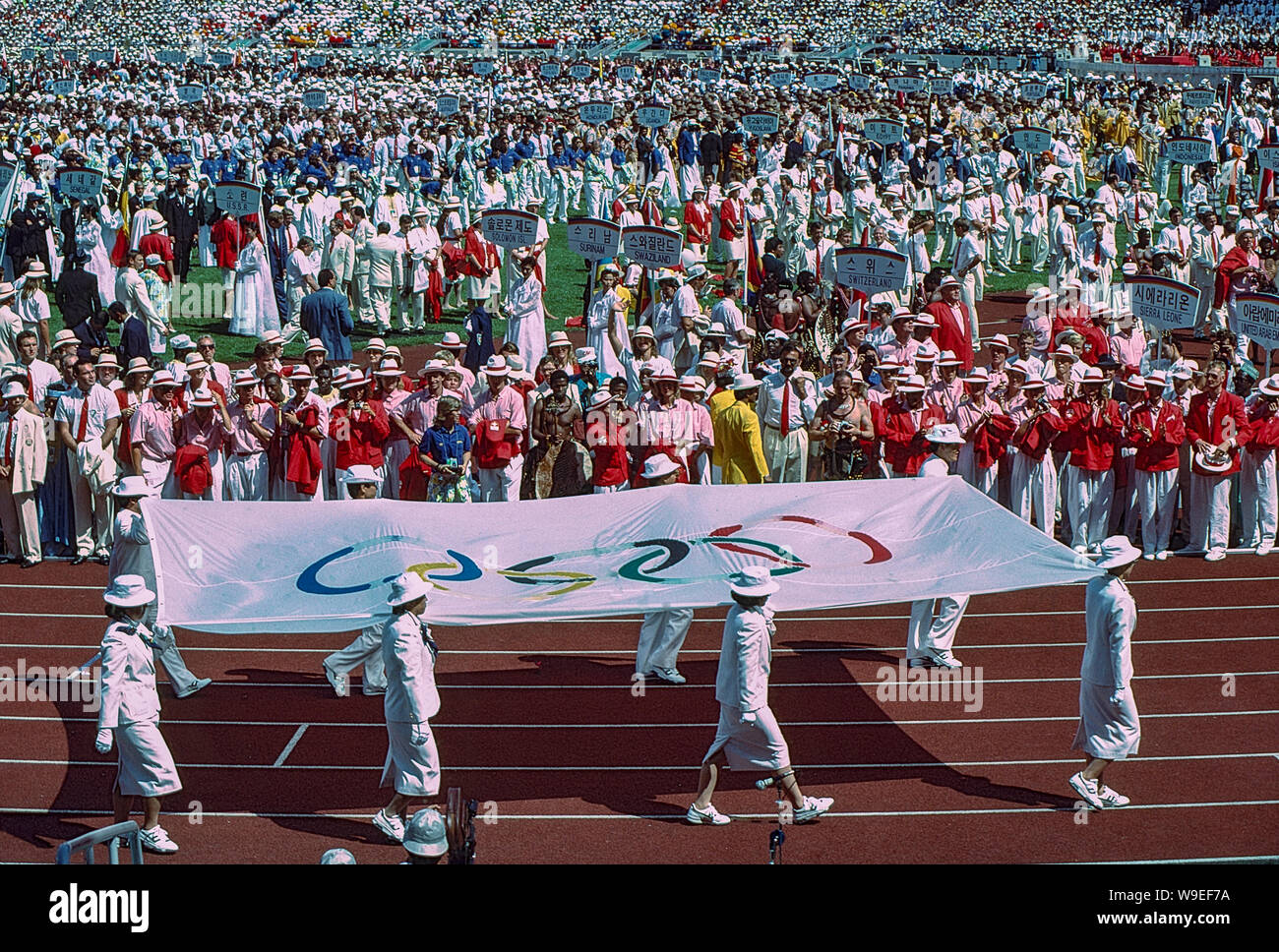 Olympic flag being carried in at the 1988 Olympic Summer Games Stock