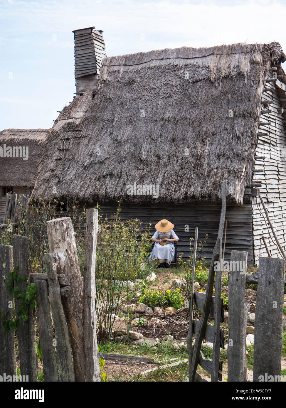 Woman in her garden in 17th Century English colony at Plymouth Colony Stock Photo Alamy