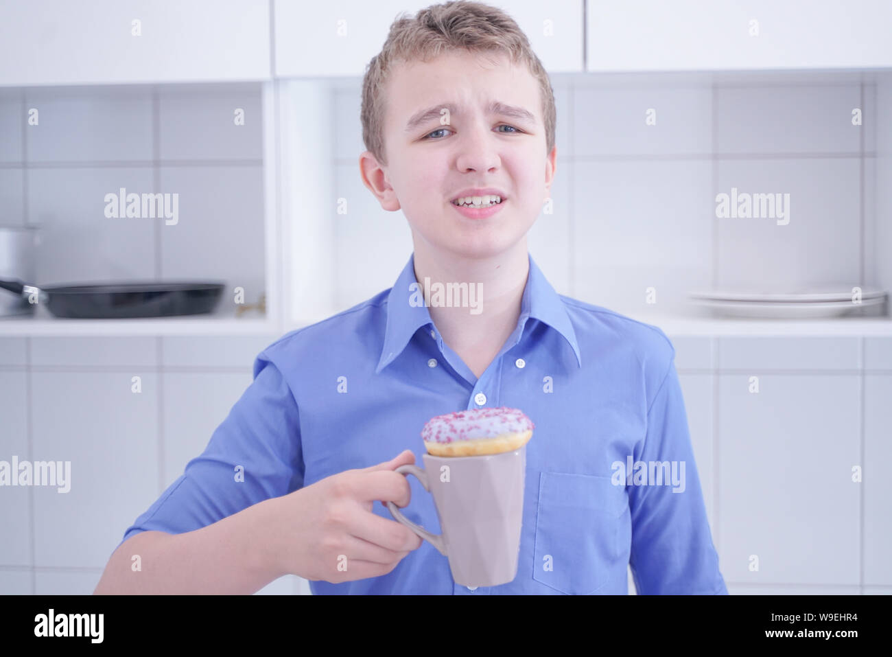 preteen handsome boy refuse to eat unhealthy food Stock Photo - Alamy