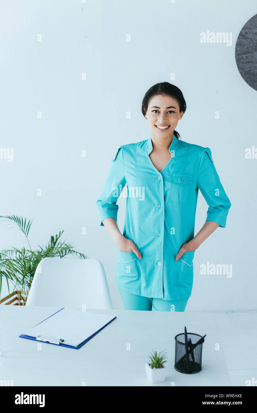 Attractive nurse standing near hi-res stock photography and images - Alamy