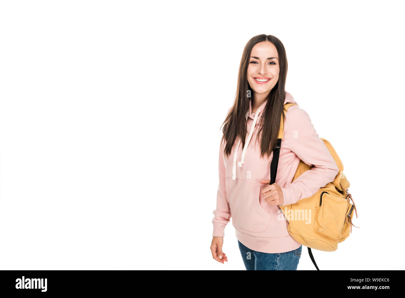 smiling brunette girl with backpack isolated on white Stock Photo - Alamy