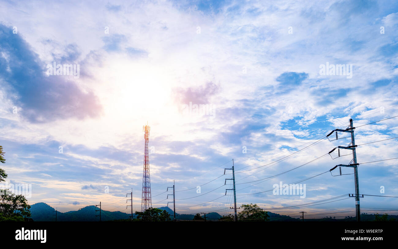 Communic ation antenna tower building with the blue sky and cloud Stock Photo