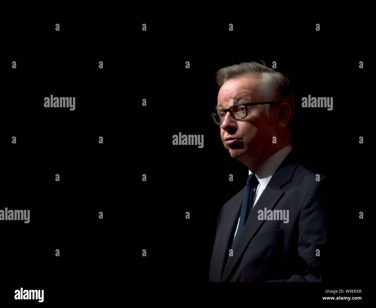 Conservative Cabinet member Micheal Gove portrait on simple black background with space for text Stock Photo