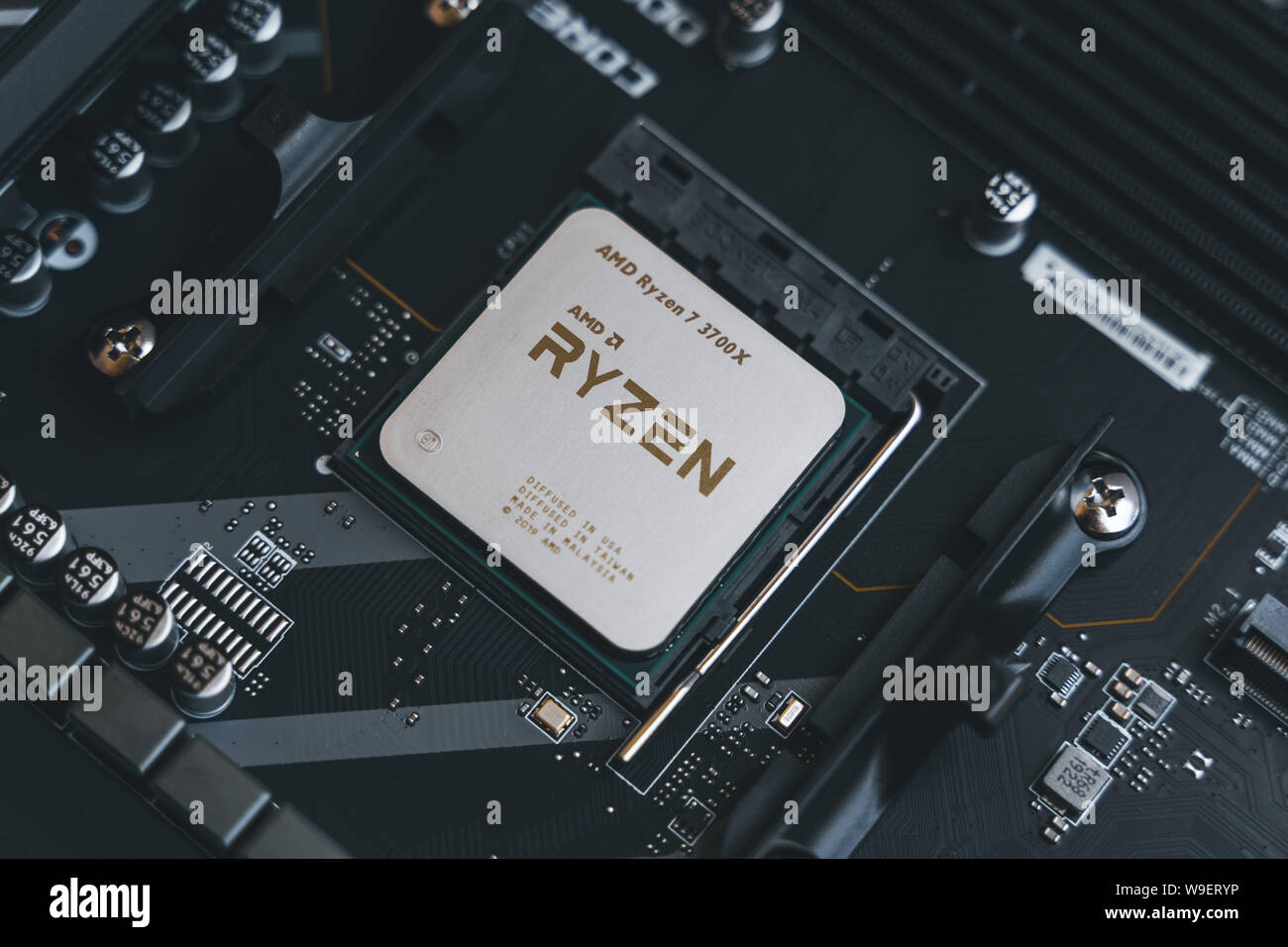 AMD Ryzen 3700x processor in the X570 motherboard socket. New Zen 2 7 nanometer desktop CPU by AMD. Very popular 3rd generation Ryzen 3000 processor Stock Photo Alamy