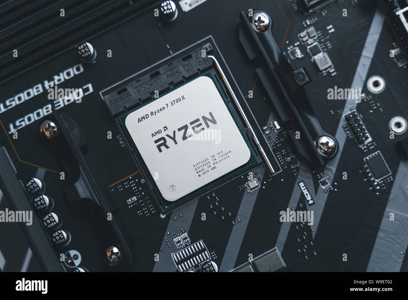 AMD Ryzen 3700x processor in the X570 motherboard socket. New Zen 2, 7  nanometer desktop CPU by AMD. Very popular 3rd generation Ryzen 3000  processor Stock Photo - Alamy