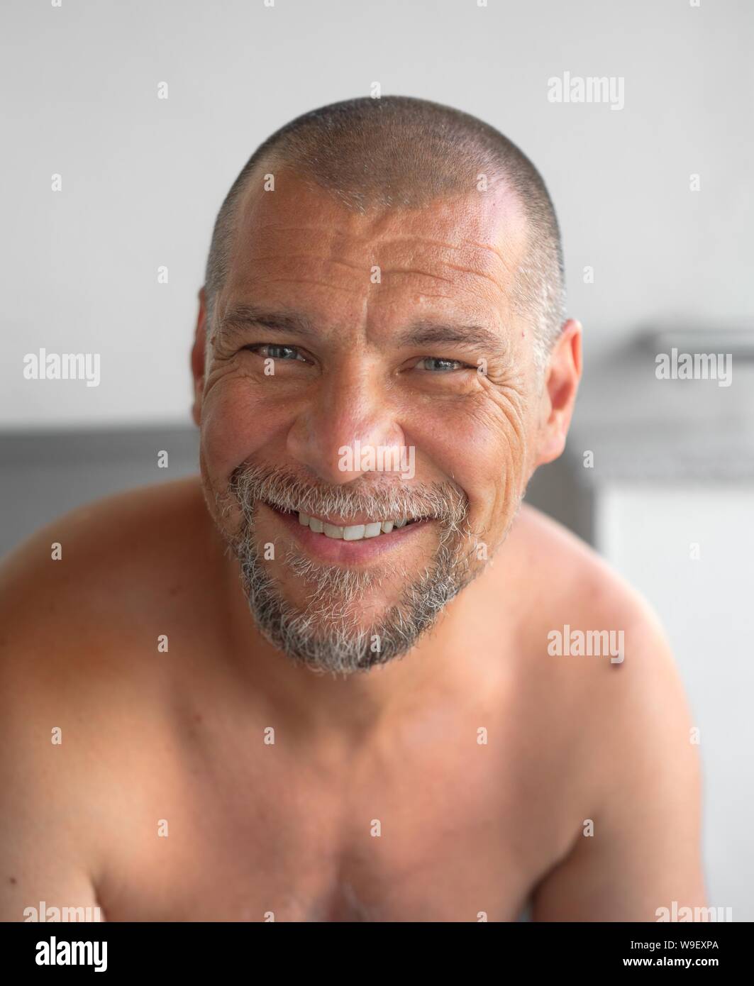 Portrait Of A Smiling Mid Forties Man With Beard And Short Hair