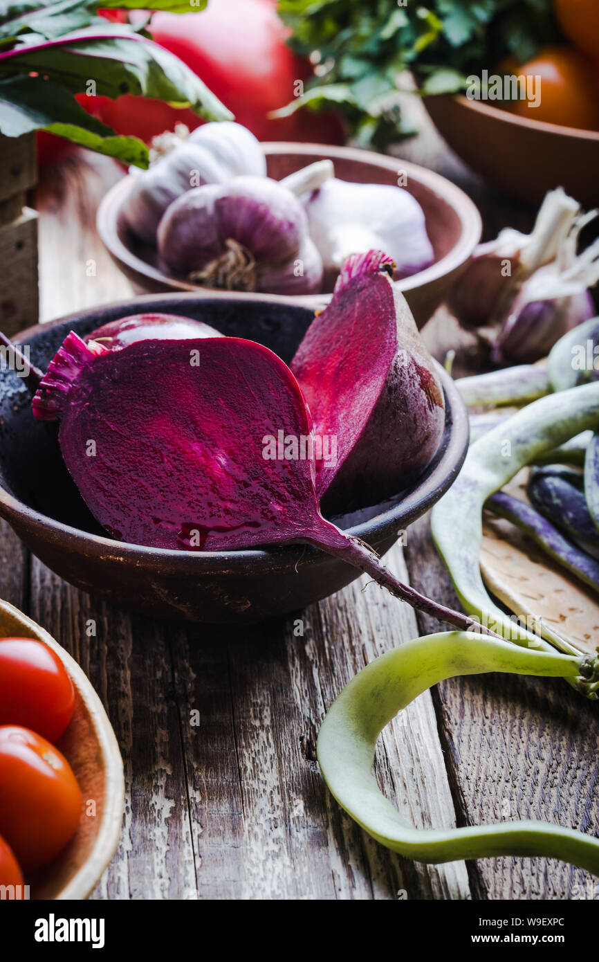 Fresh organic colorful homegrown vegetables on rustic wooden table ...