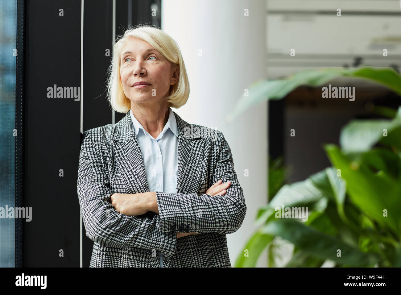 Blond mature woman thinking hi-res stock photography and images - Alamy
