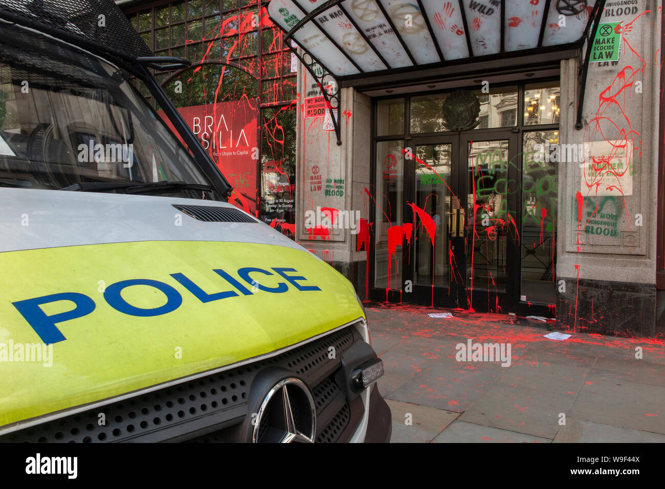 13 August 2019 - aftermath of attack on the Brazilian embassy by Extinction Rebellion. Paint and vandalism daubs the exterior with police protection. Stock Photo