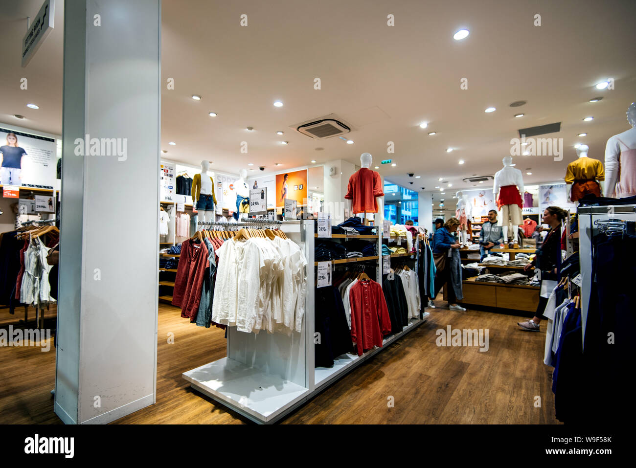 Strasbourg France - May 18, 2019: interior of modern Uniqlo fashion store  selling large selection of women and male clothes Stock Photo - Alamy