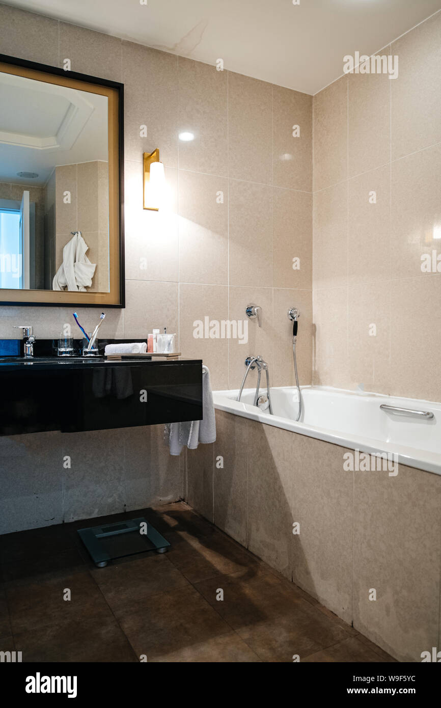 Interior of five star hotel with large bathroom marble walls and