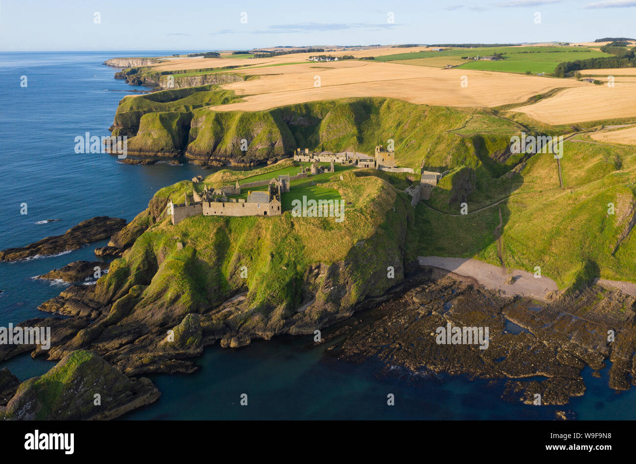 Aerial view of Dunnottar Castle a ruined medieval fortress located upon a rocky headland south of the town of Stonehaven, Aberdeenshire,  Scotland. Stock Photo