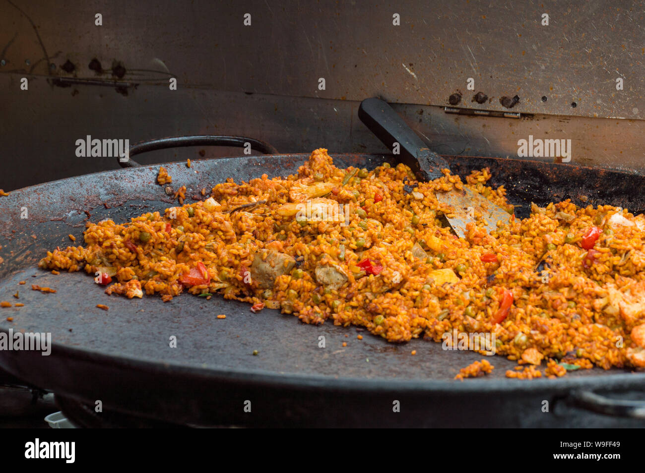 Paella on a big pan in food market stall Stock Photo Alamy