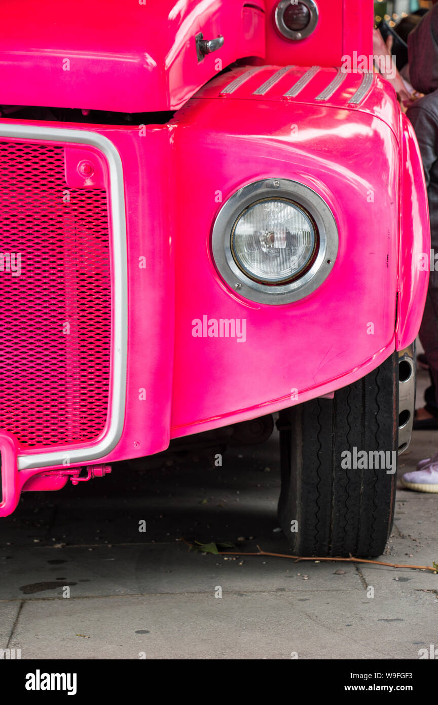 Partial view of pink bus Stock Photo