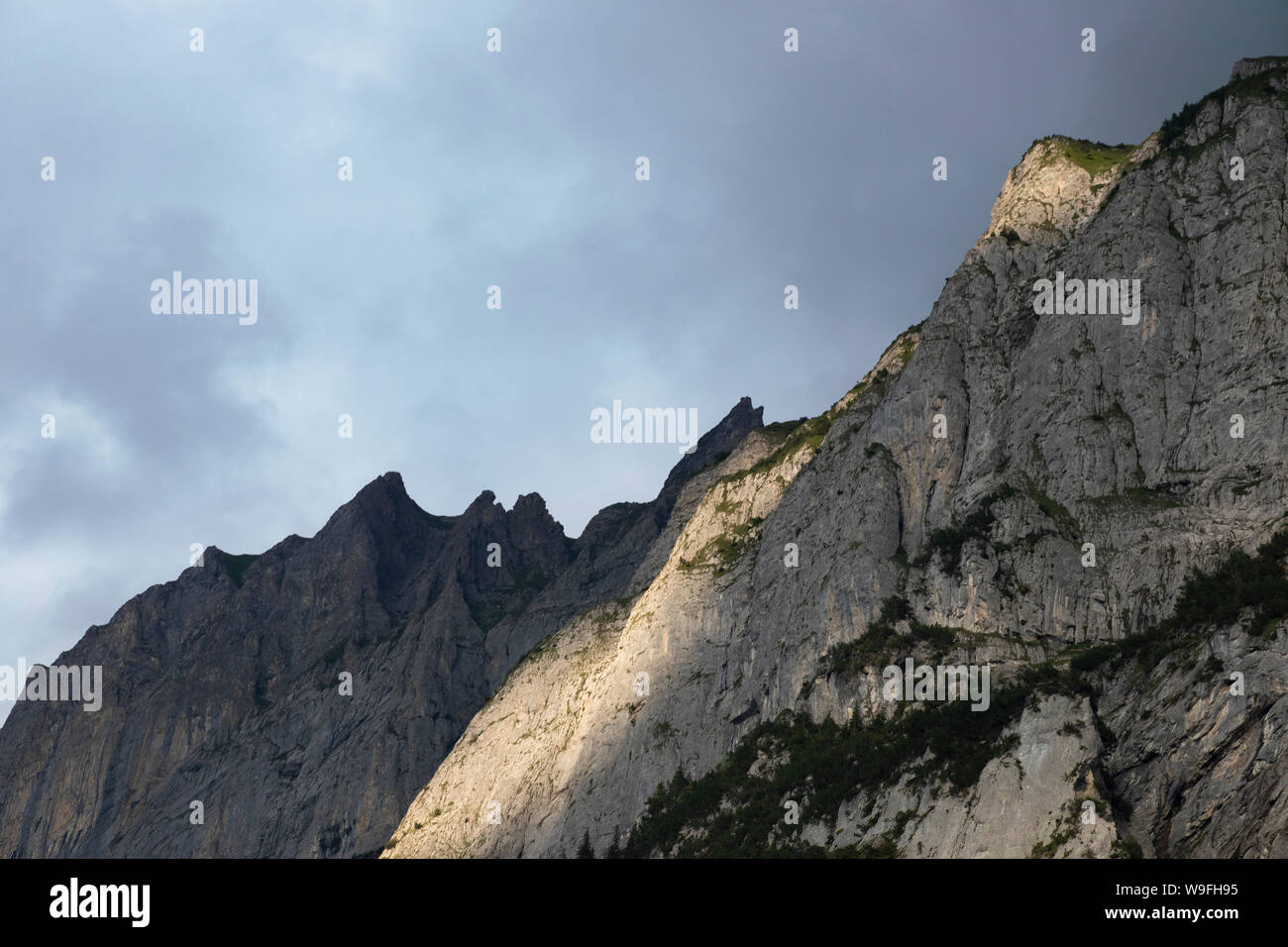 Sunlit rocks on the mountain top. Peaks of the alp at sunset time. Rock  formations with sun light. Rocky Mountain detailed close up. Switzerland  Stock Photo - Alamy