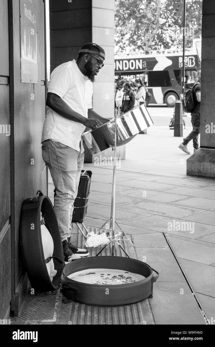 Monochrome of Street music performer at the Westminster station exit Stock Photo