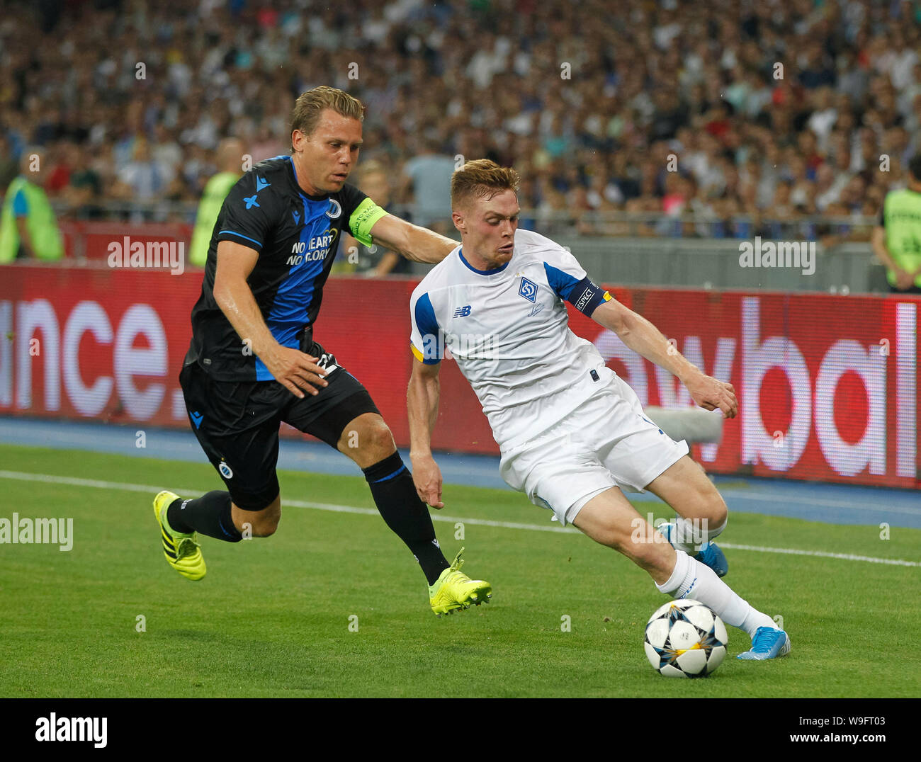 Ruud Vormer of Brugge (L) and Viktor Tsygankov of Dynamo Kyiv (R) fight for the ball, during the UEFA Champions League third qualifying round second leg football match between FC Dynamo Kyiv and Club Brugge KV, at the NSC Olimpiyskiy stadium in Kiev, Ukraine. (Final score; Dynamo Kyiv 3:3 Club Brugge KV) Stock Photo