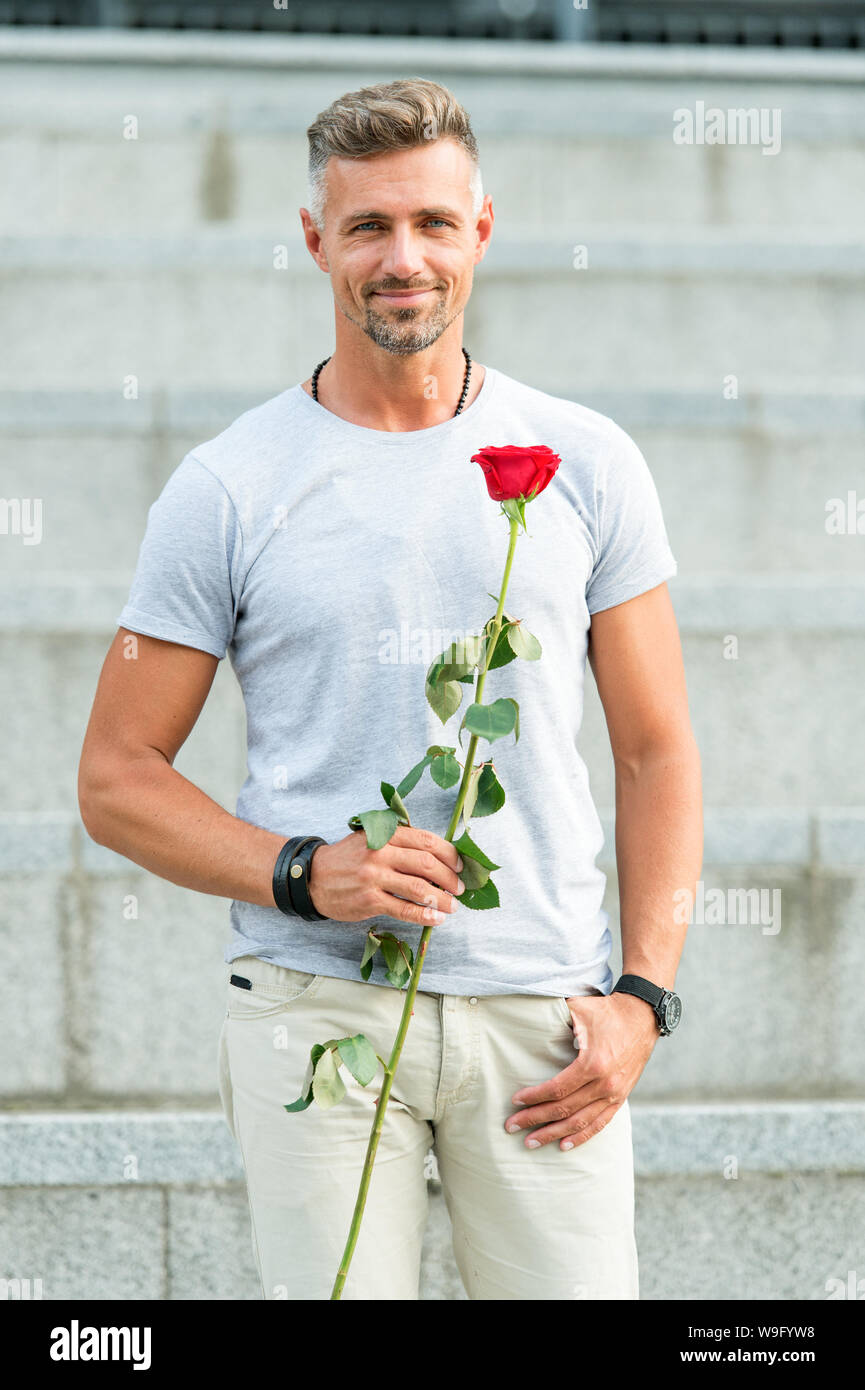 Life is too short to live without love. Man mature well groomed macho wait  for his darling. Handsome guy with rose flower romantic date. Man in love  romantic mood. Surprise for his