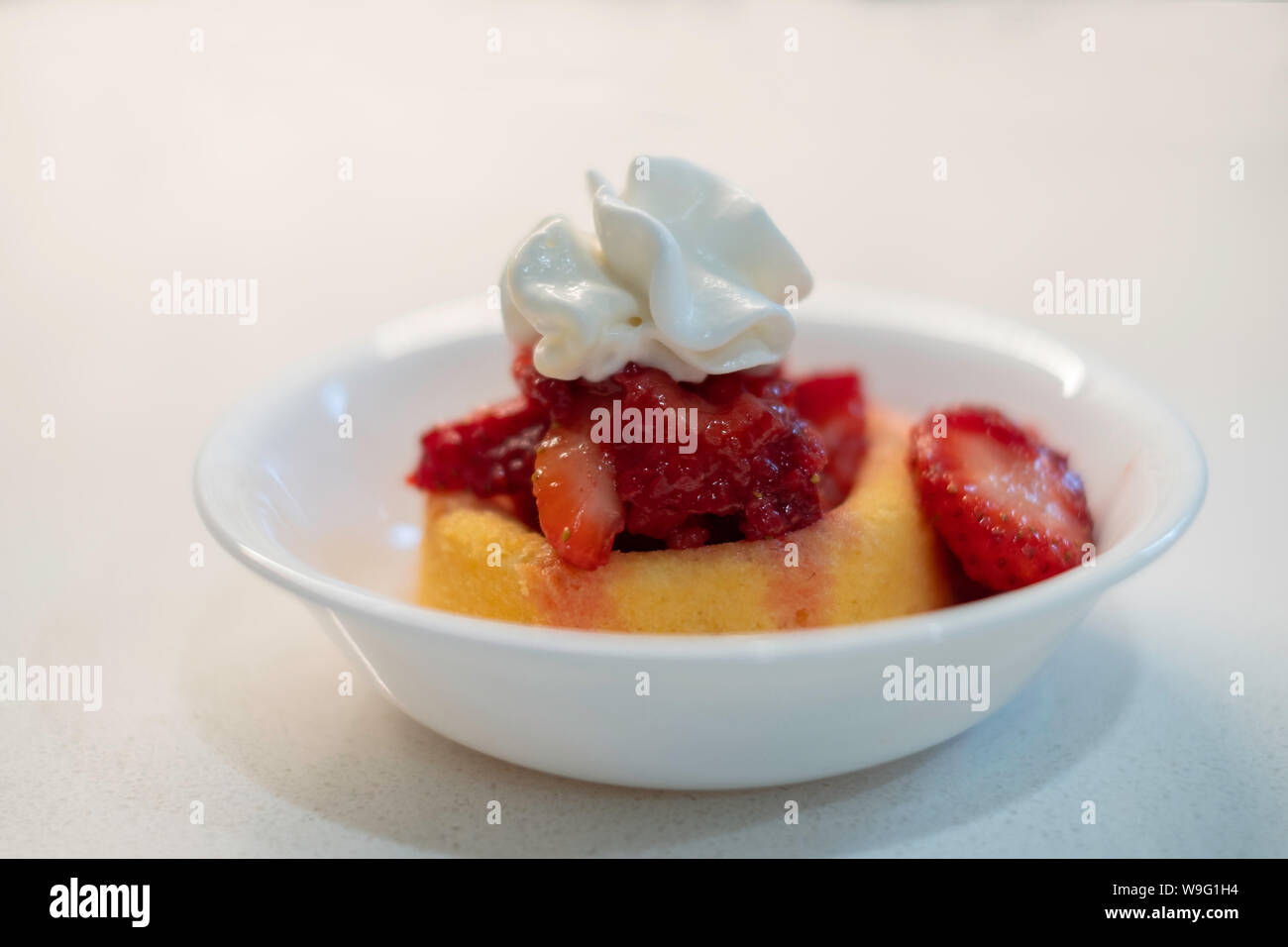 Strawberries on sponge cake with whipped cream. Strawberry shortcake. USA. Stock Photo