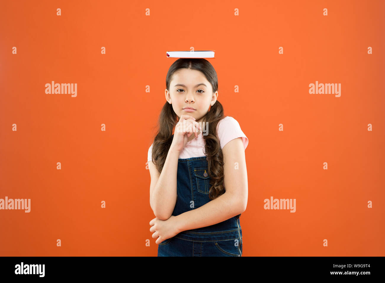 Childhood memories. poetry and novel. modern education. school girl read  book on orange background. thinkign little girl with notebook. writing  notes. kid diary. literature lesson. back to school Stock Photo - Alamy