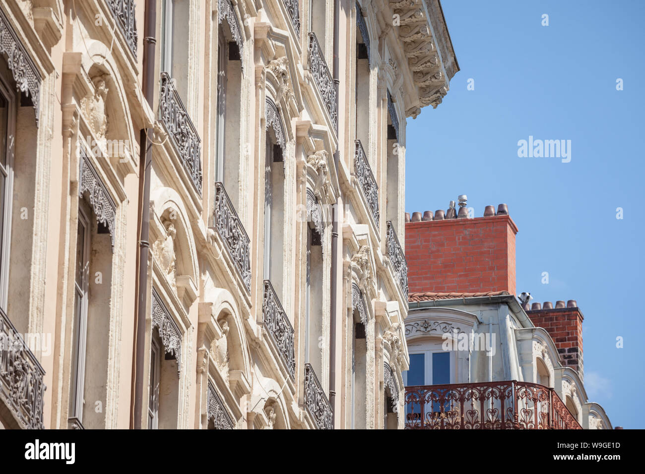 Typical Haussmann style facades, from the 19th century, traditional in the city centers of French cities such as Paris and Lyon, with their traditiona Stock Photo