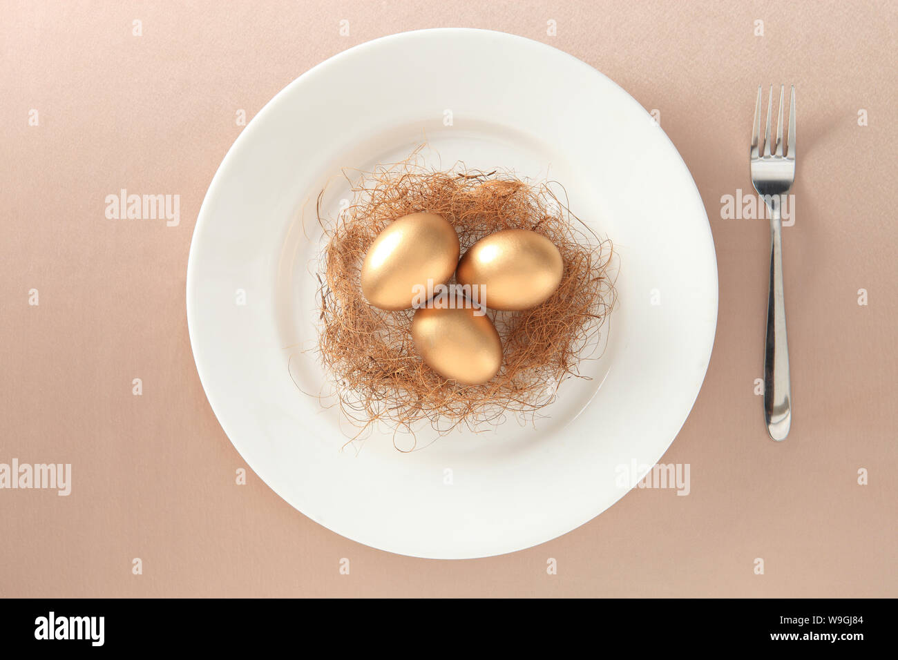 Golden eggs in a nest Stock Photo - Alamy