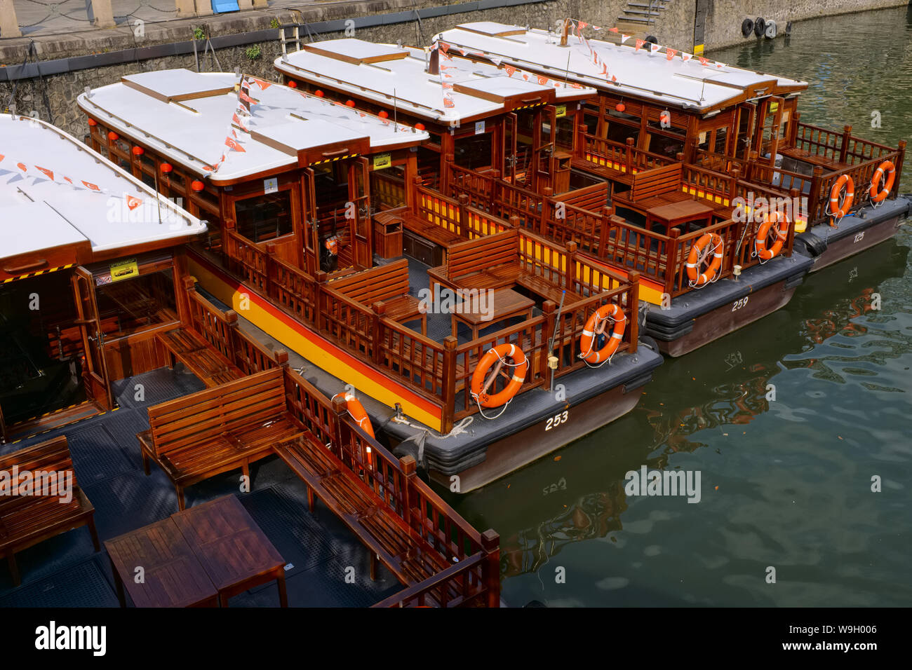 Excursion boats anchored off Clarke Quay, at a pier by the Singapore ...