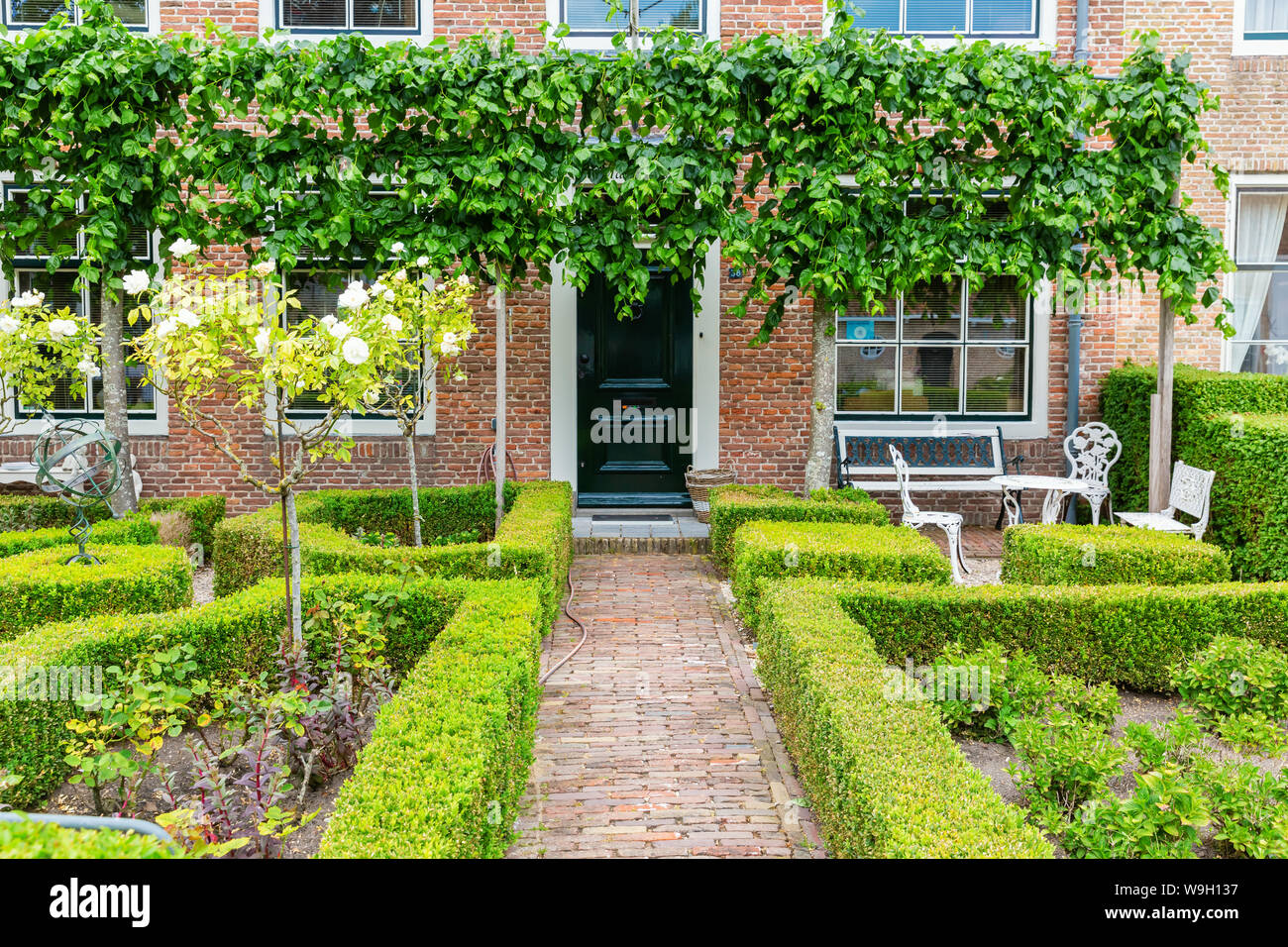Veere, Netherlands - June 09, 2019: frontyard in Veere. Veere is famous for its picturesque old town and a popular destination for day tripper Stock Photo