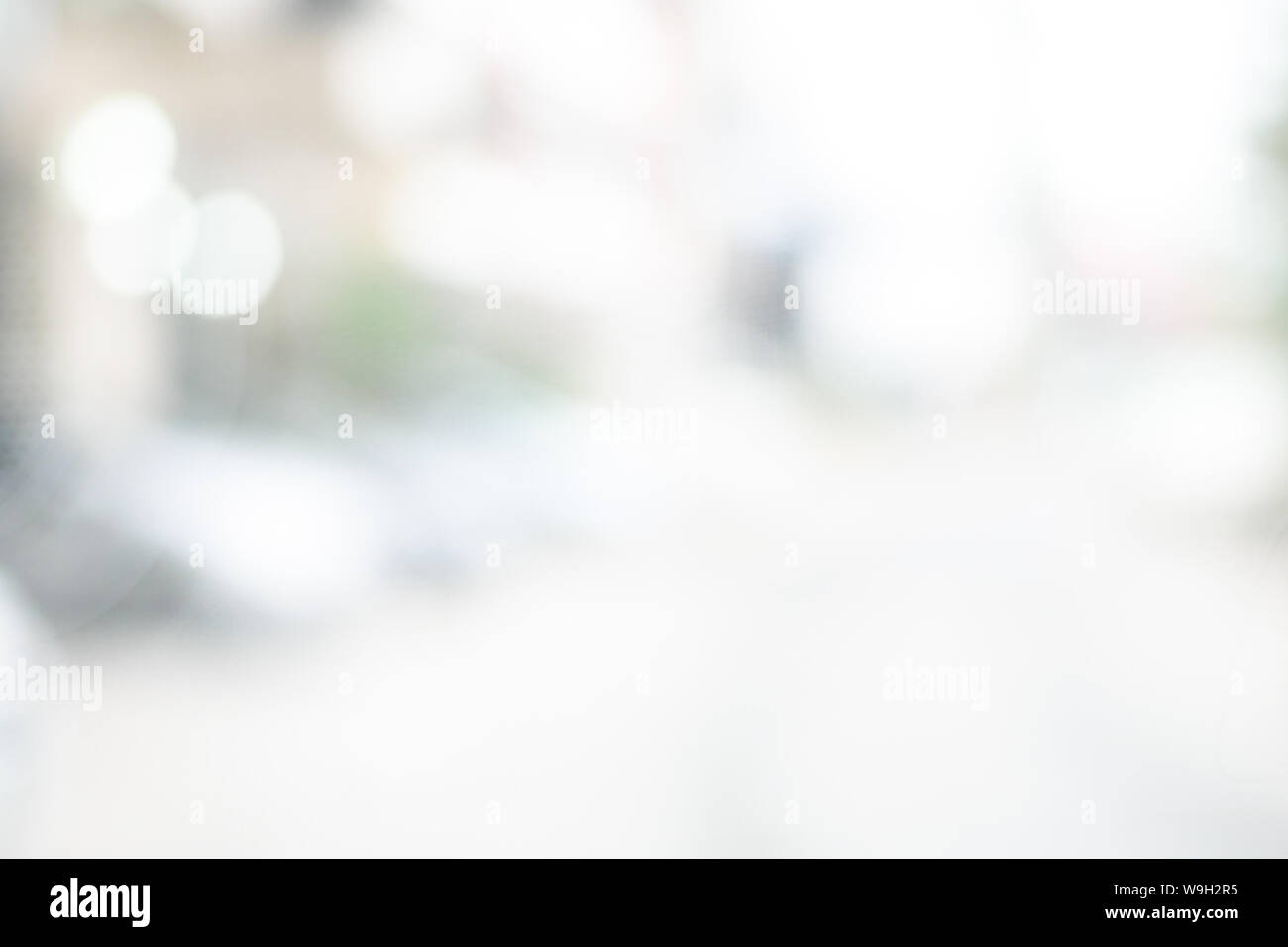 Abstract black and white bright bokeh interior background with white table top for backdrop design, bokeh composition for , website, magazine or Stock Photo