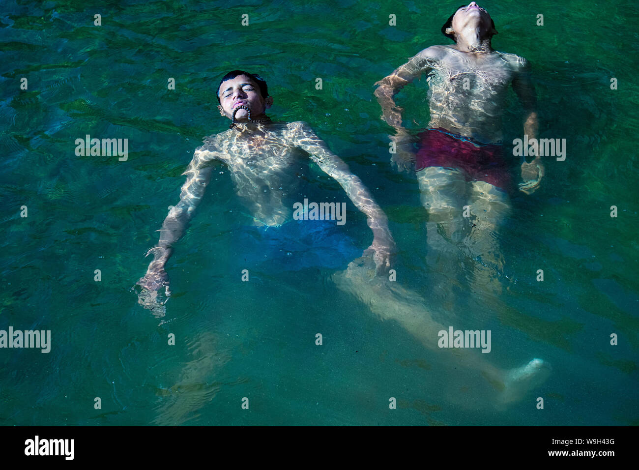 Himachal Pradesh, india - July 20th, 2019: Floating dead bodies of a drowned male children in River swimming pool murder. concept of safety Stock Photo
