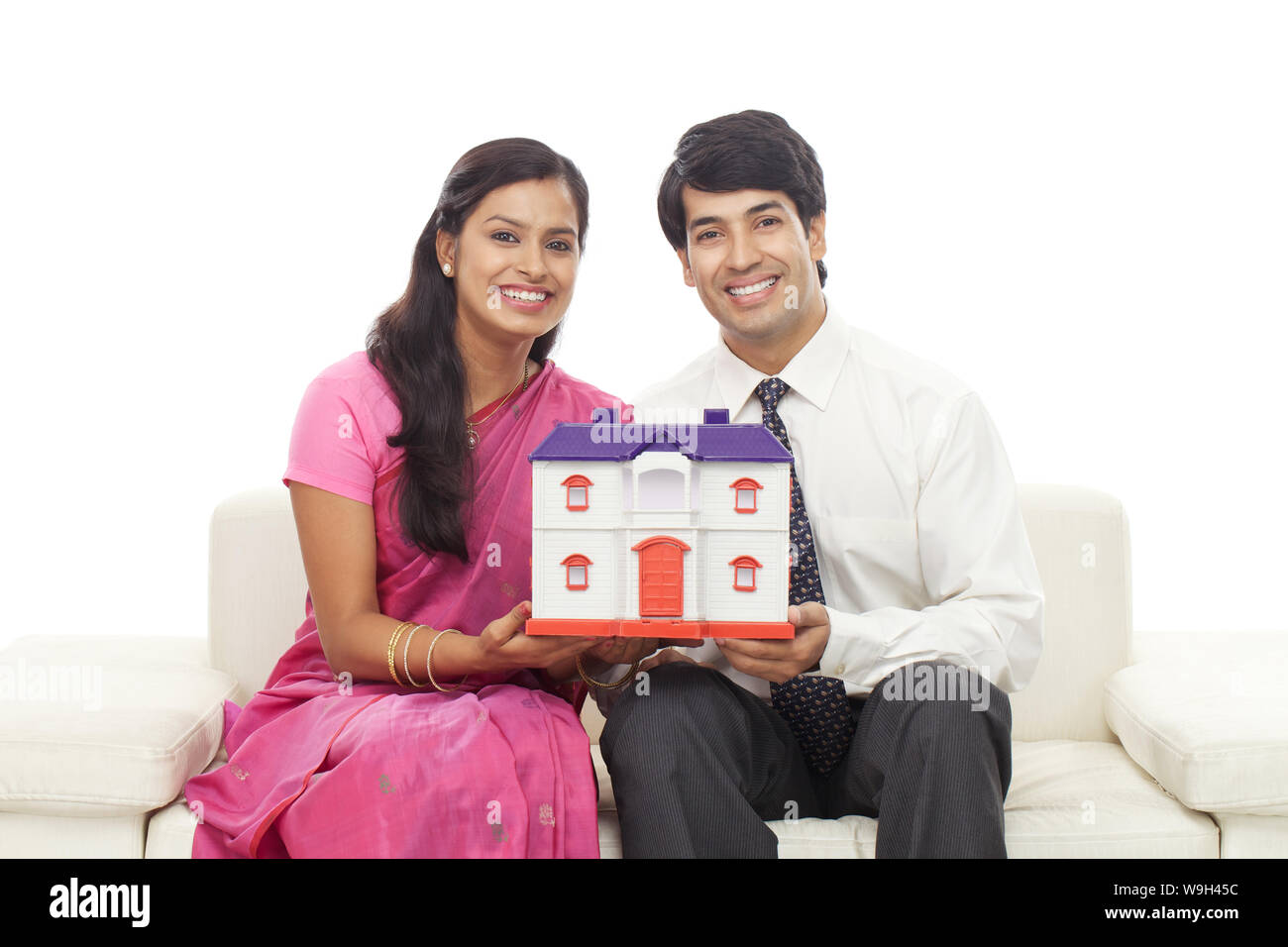 Young couple holding a dream home Stock Photo - Alamy