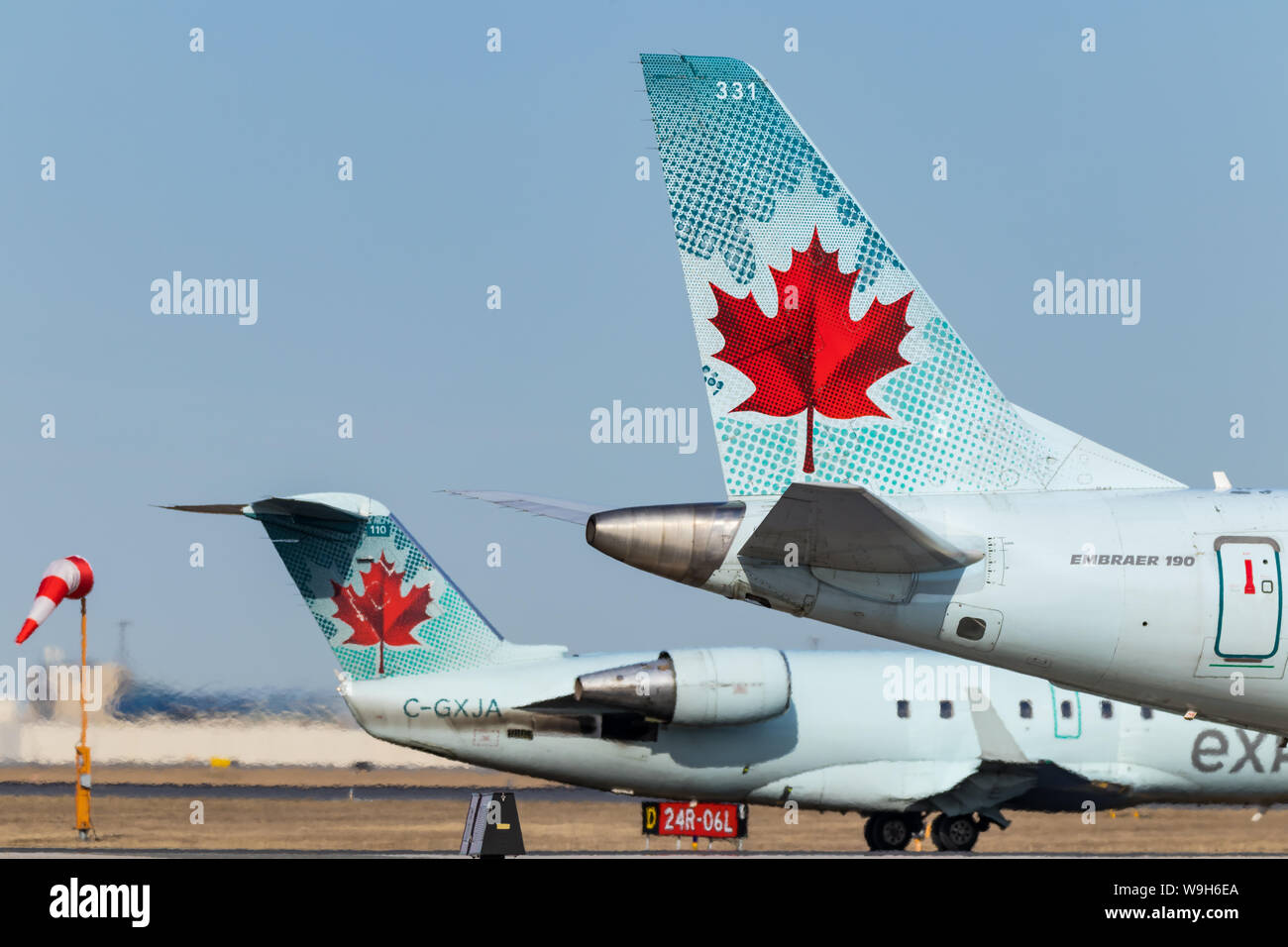 Air Canada tails seen while holding for takeoff at Toronto Pearson Intl. Airport. Stock Photo
