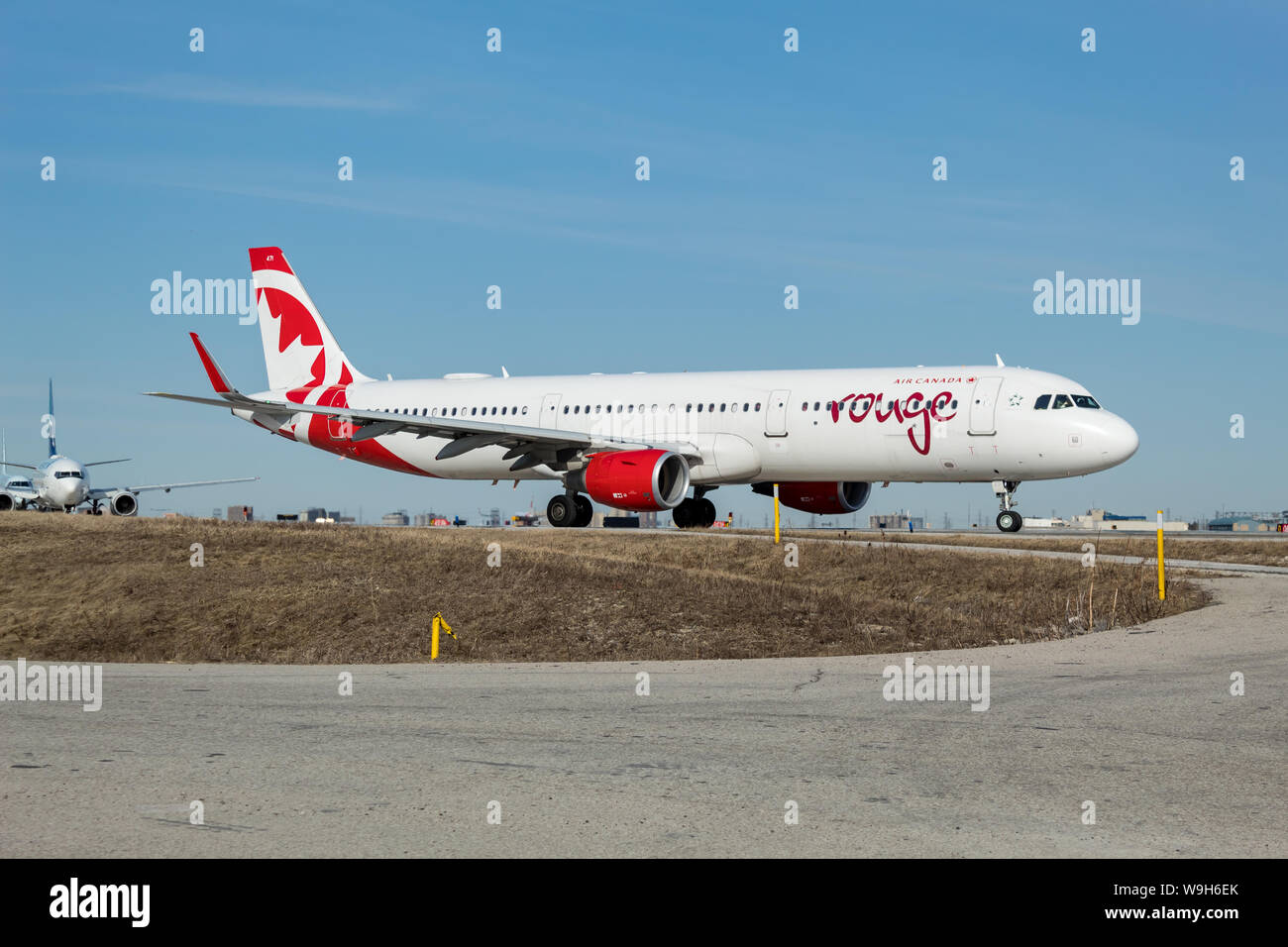 Air Canada Rouge Airbus A321 on a taxiway at Toronto Pearson Intl. Airport. Stock Photo