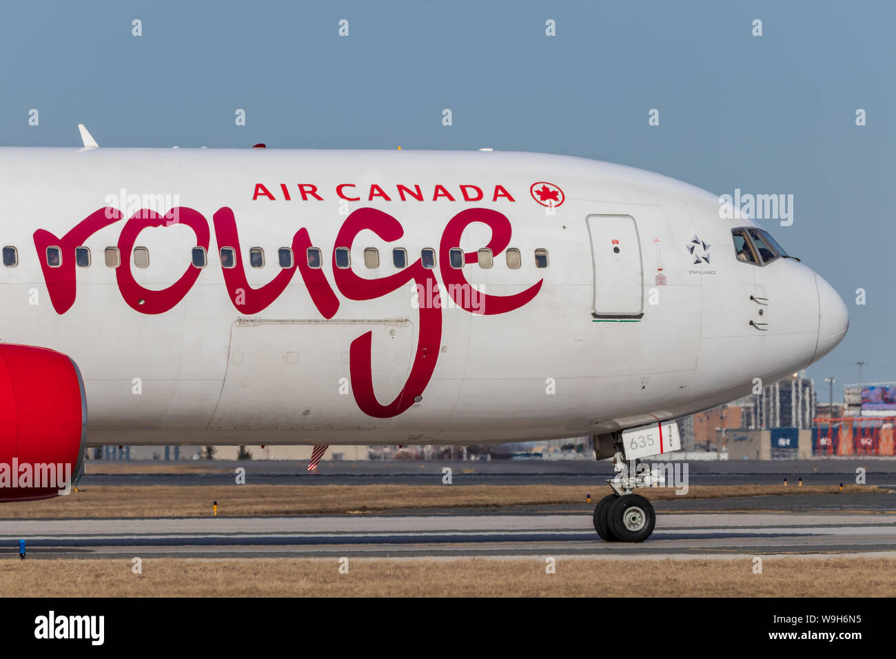 Air Canada Rouge Boeing 767 lining up for takeoff at Toronto Pearson Intl. Airport. Stock Photo