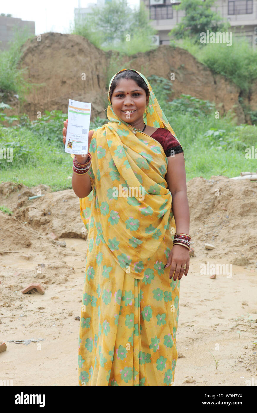 Rural woman showing an Aadhar card Stock Photo