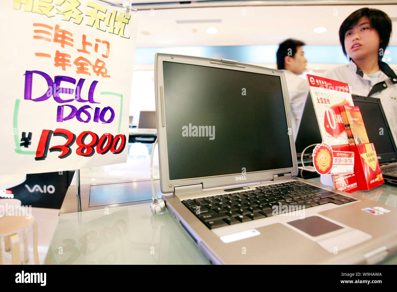 Chinese customers shop for Dell laptop computers at a store in Shanghai